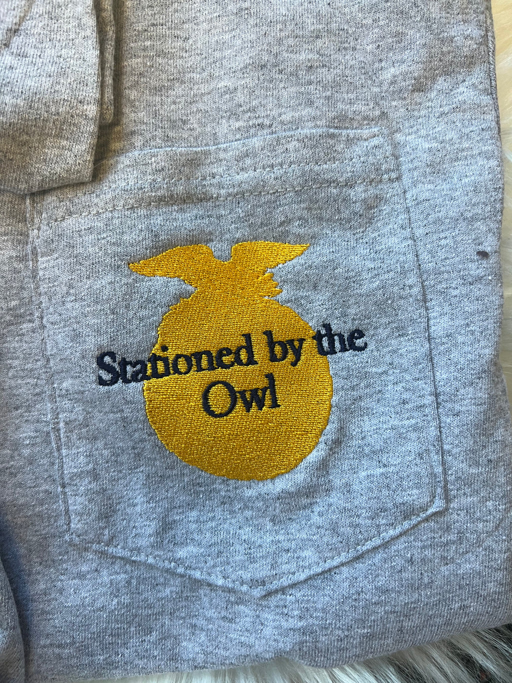 Stationed By Embroidered Pocket Tee